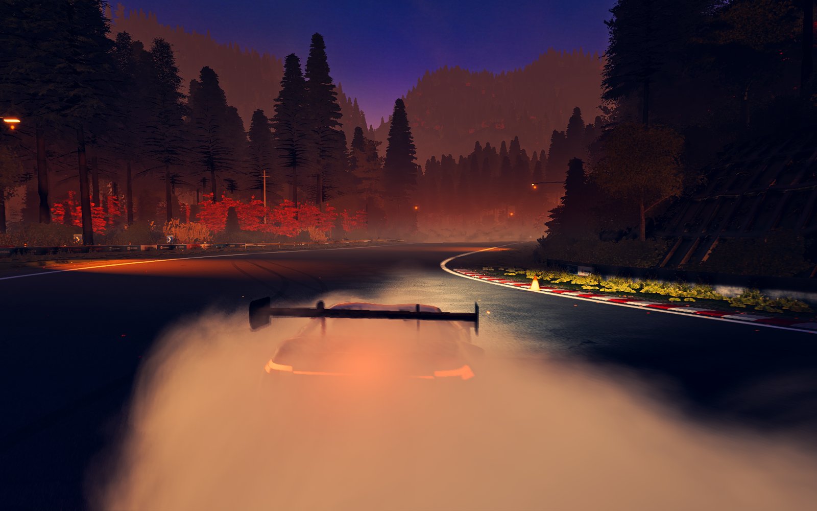 The mountain road at sunset with mist in the valley below